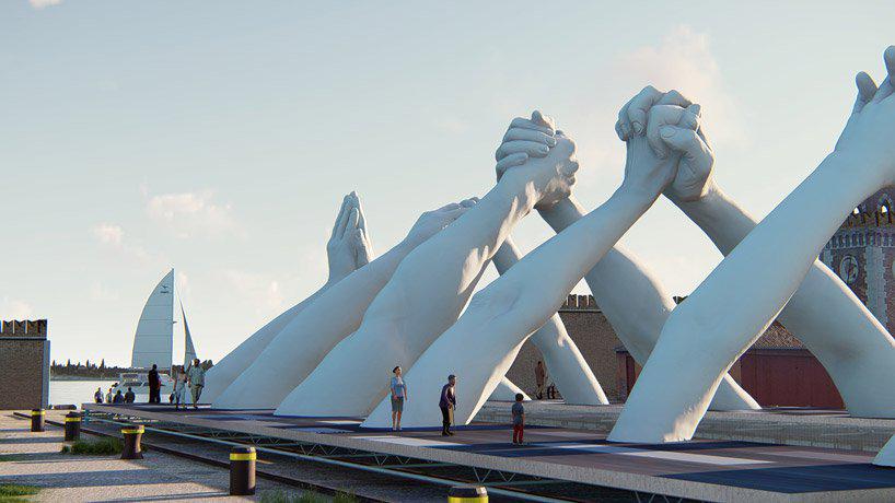 lorenzo quinn joins giant hands to build bridges during venice art biennale 2019
