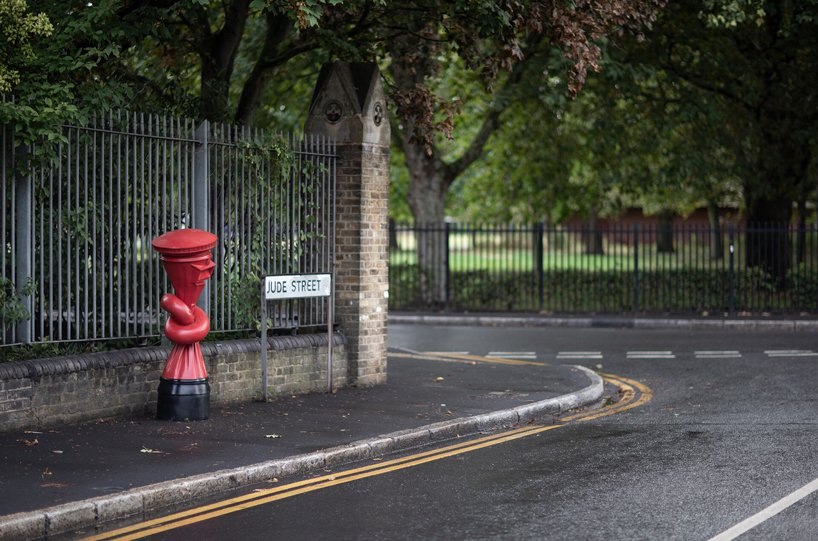 alex chinneck installs knotted post boxes across the UK