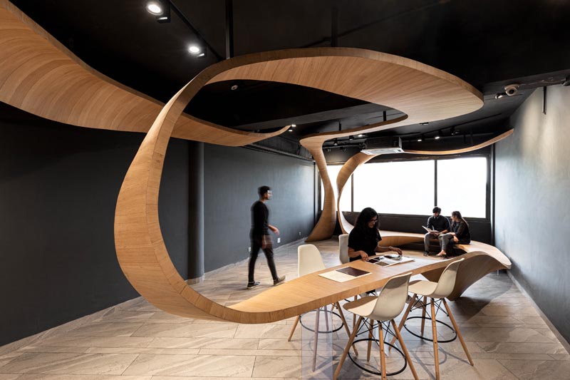 This Sculptural Wood Element Draws Inspiration From The Flowing Curves Of A Ribbon