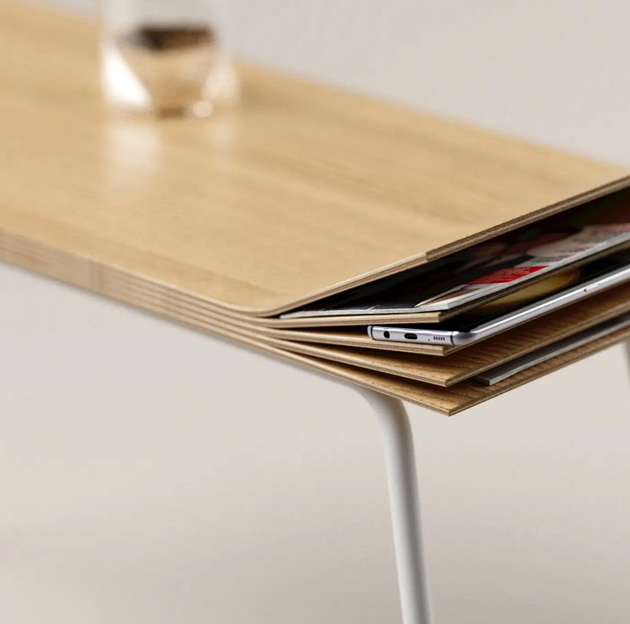 The Flitter Console Table has a splintering end that creates multiple little storage "pockets"