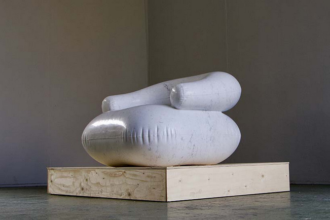 Sculpture hand-carved from 600 kg of carrara marble emulates a plastic inflatable chair