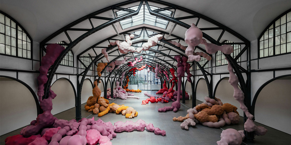 Inflated organ sculptures by eva fàbregas grow out of metal beams at hamburger bahnhof
