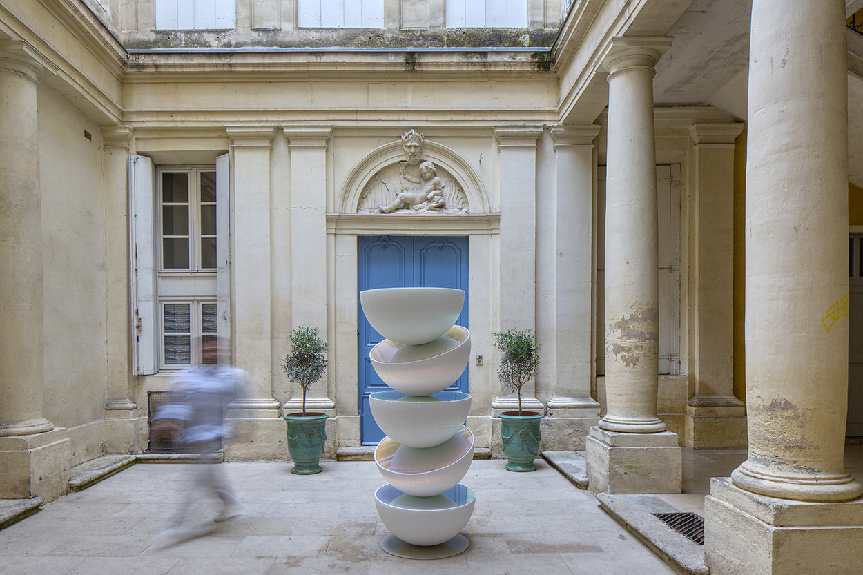 vicente spinola`s totem installation stacks reflective semispheres, pondering the climate crisis