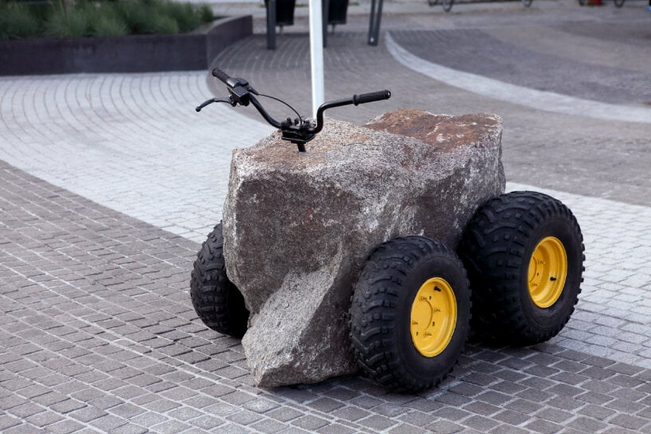 Baptiste debombourg carves granite into jet ski and all-terrain vehicle sculptures in quebec