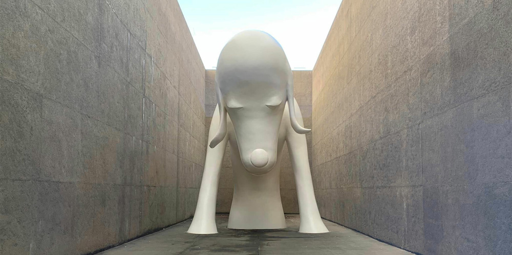 Colossal dog sculpture welcomes visitors to yoshitomo nara`s solo exhibition in aomori, japan