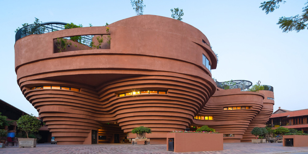 1+1>2 architects` pottery museum rises like a canyon amid the bat trang village in vietnam