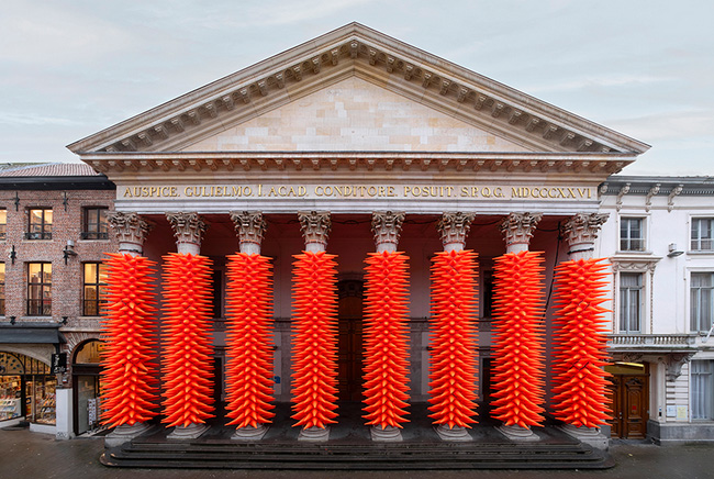 SpY wraps neoclassical columns in ghent with 1984 luminous traffic cones for lichtfestival