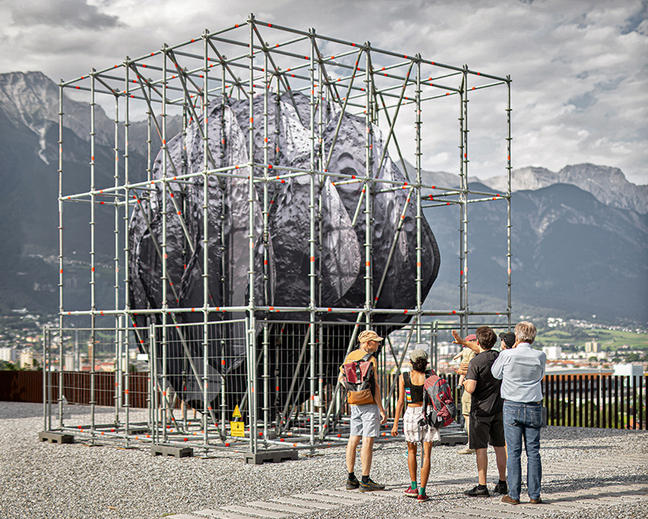 Thomas medicus` public installation encloses 3D asteroid in cuboid scaffolding