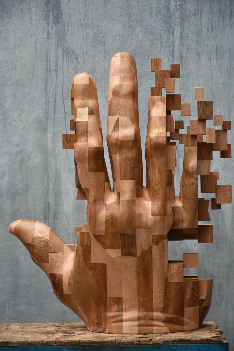 han hsu-tung crafts intricate pixelated sculptures made of wood