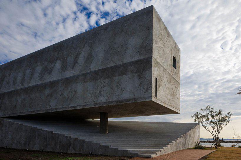 mount fuji architects studios concrete residence emerges from a rocky peninsula in japan