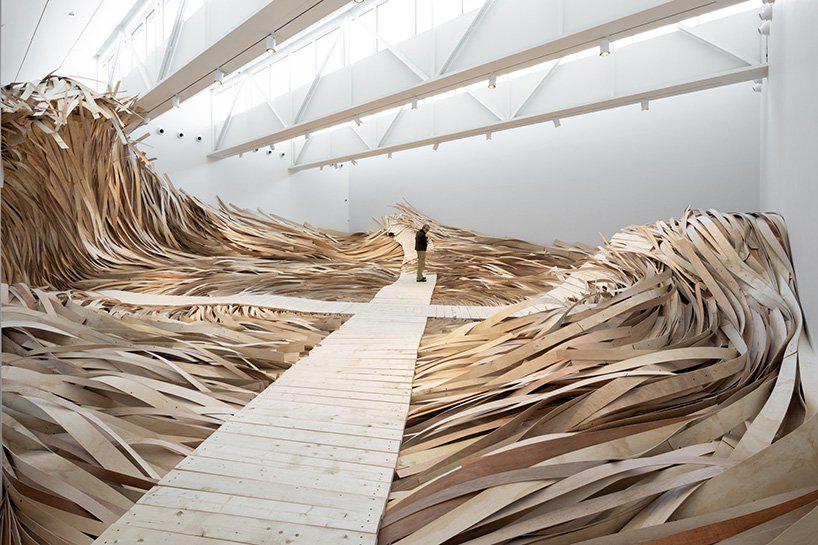 wade kavanaugh + stephen b. nguyen install immersive tidal wave of wood at CMCA