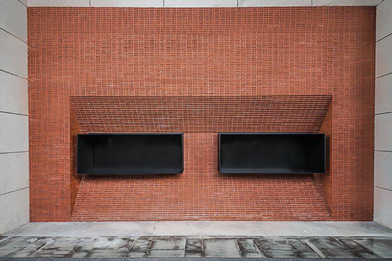 GEOM design stacks red bricks to build the façade of JPG coffee in china
