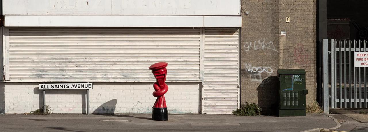 alex chinneck installs knotted post boxes across the UK