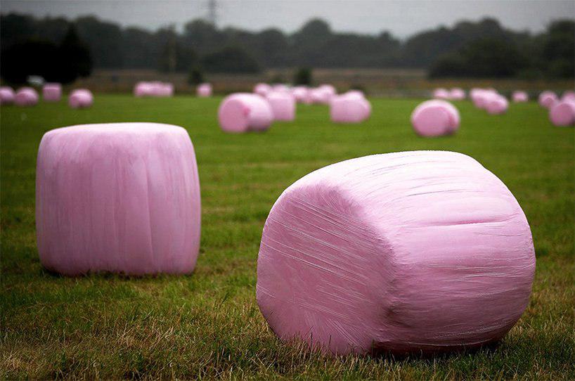 tobia zambotti stacks pink hay bales in rural iceland to raise awareness of breast cancer