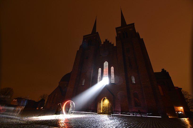 SIIKUs LUX NOVA beams a circle of light outside roskilde cathedral in denmark