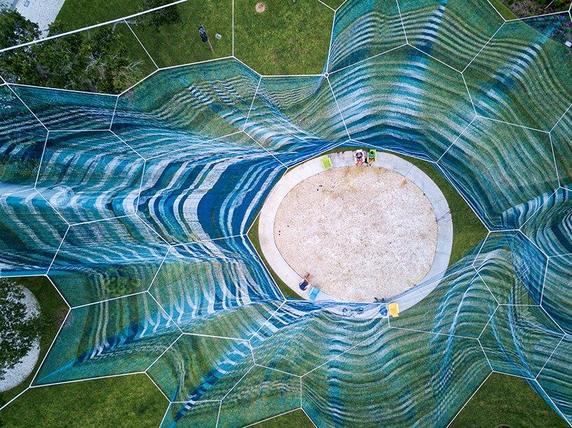 studio echelmans billowing soft sculpture bending arc floats above florida pier