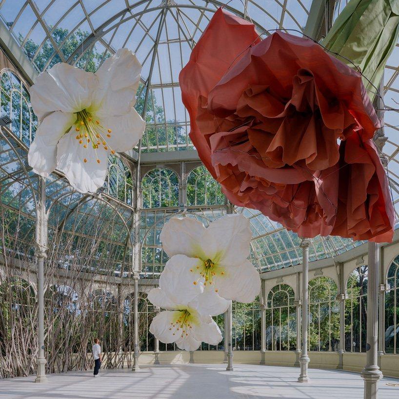 petrit halilaj turns madrids palacio de cristal into nest of giant flowers