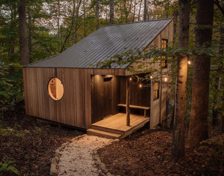This Small House In The Forest Has High Ceilings To Allow For Two Loft Spaces