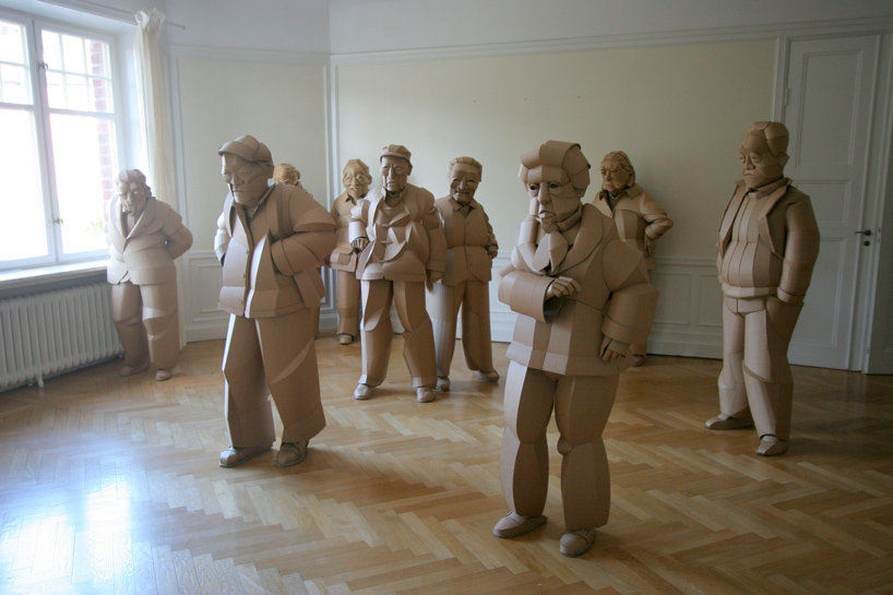 warren king uses cardboard to sculpt full-scale villagers of his ancestral chinese home