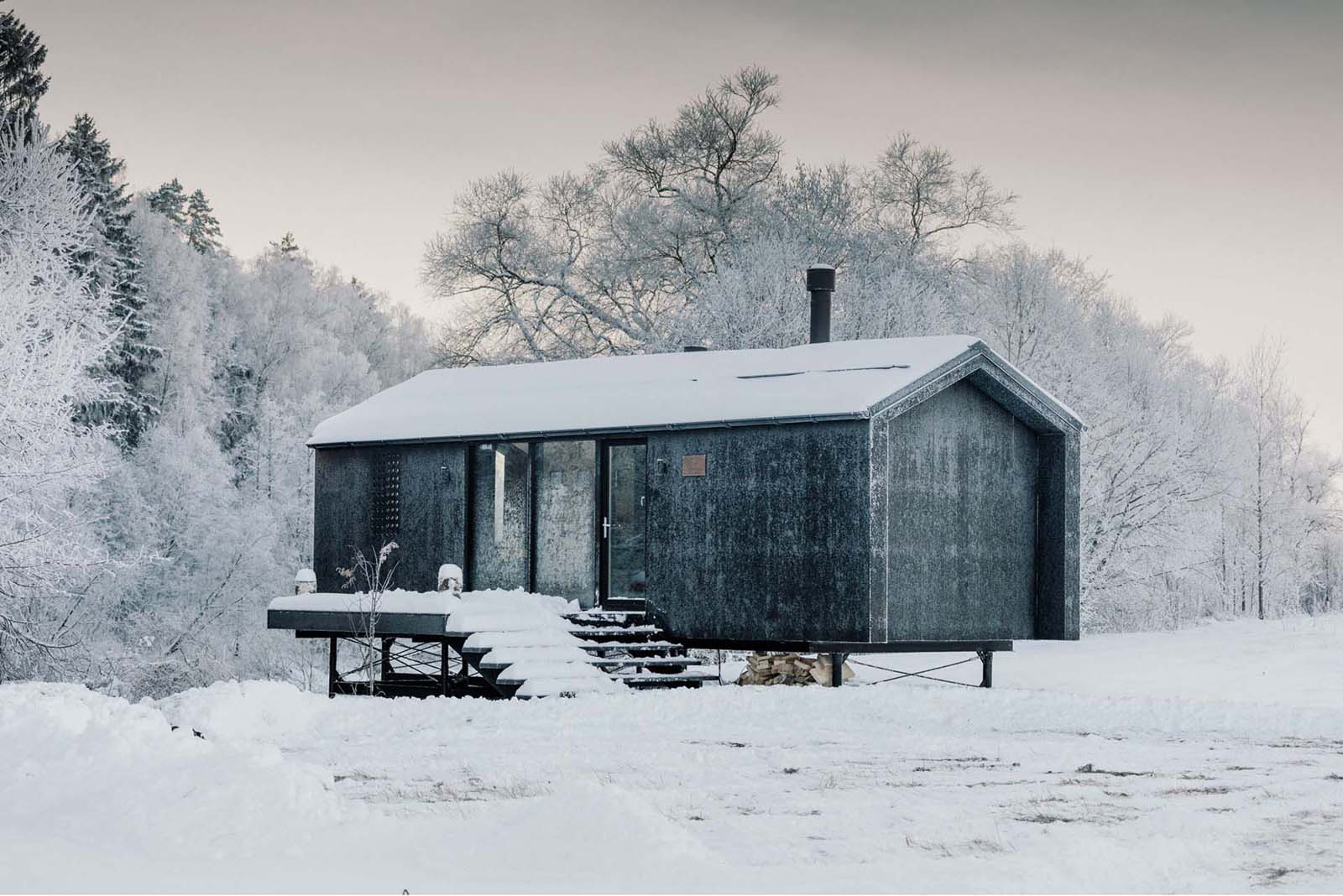 The Oak-Lined Interior Of This Cabin Is A Warm Escape From The Weather Outside